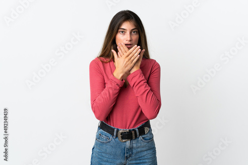 Young caucasian woman isolated on white background covering mouth with hands
