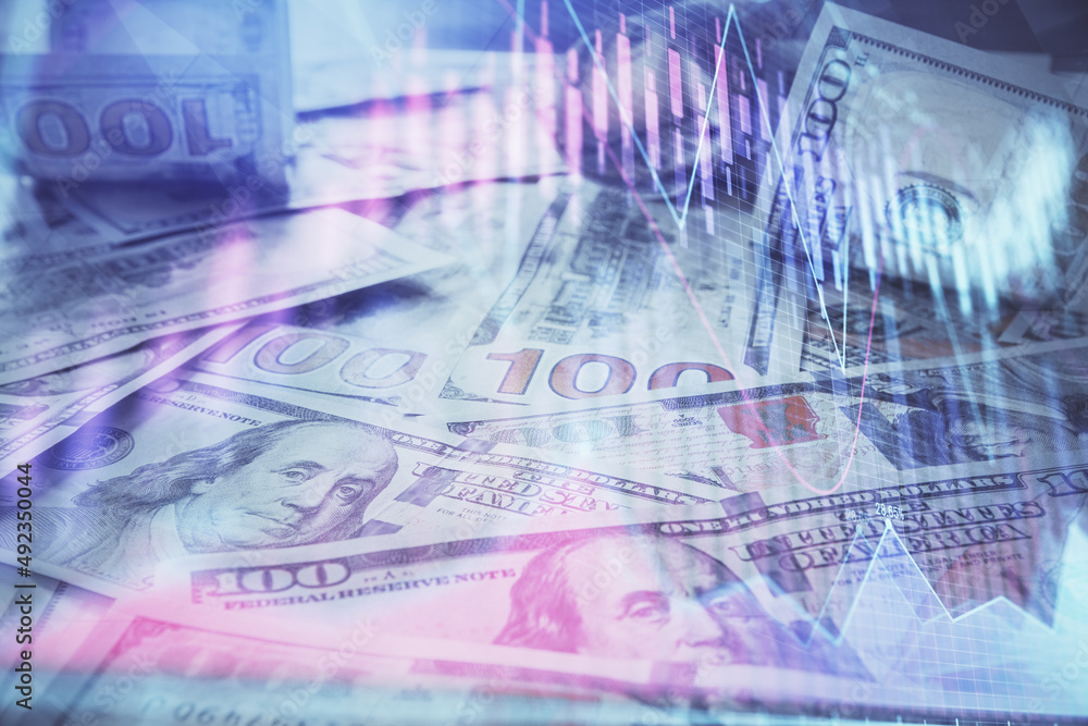 Fototapeta premium Multi exposure of forex chart drawing over us dollars bill background. Concept of financial success markets.