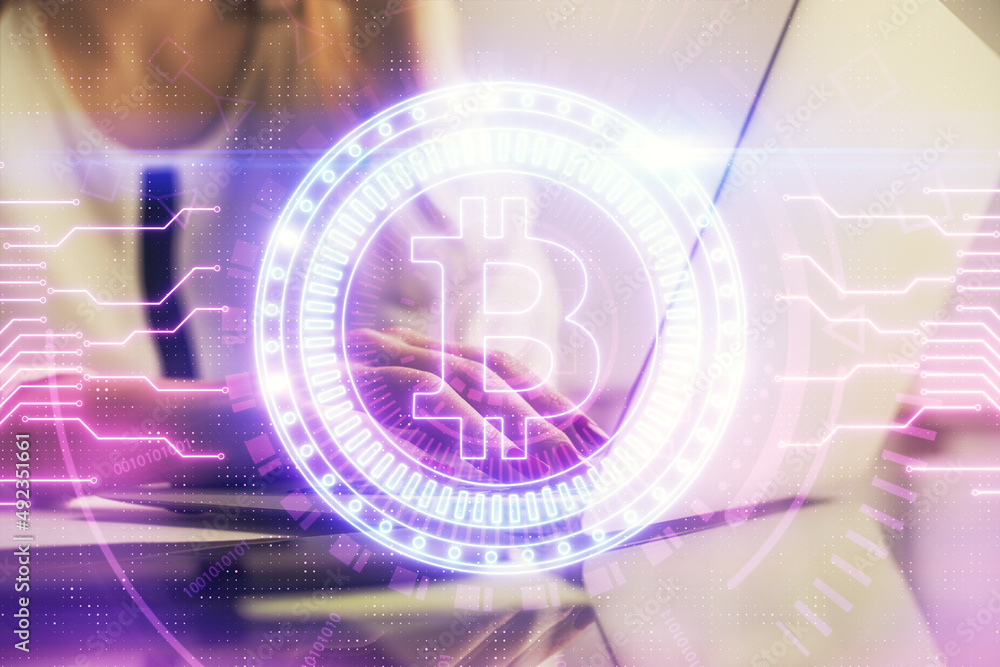 Double exposure of woman hands typing on computer and crypto market theme hologram drawing. Blockchain concept. Double exposure of woman hands typing on computer and crypto market theme hologram drawing. Blockchain concept.