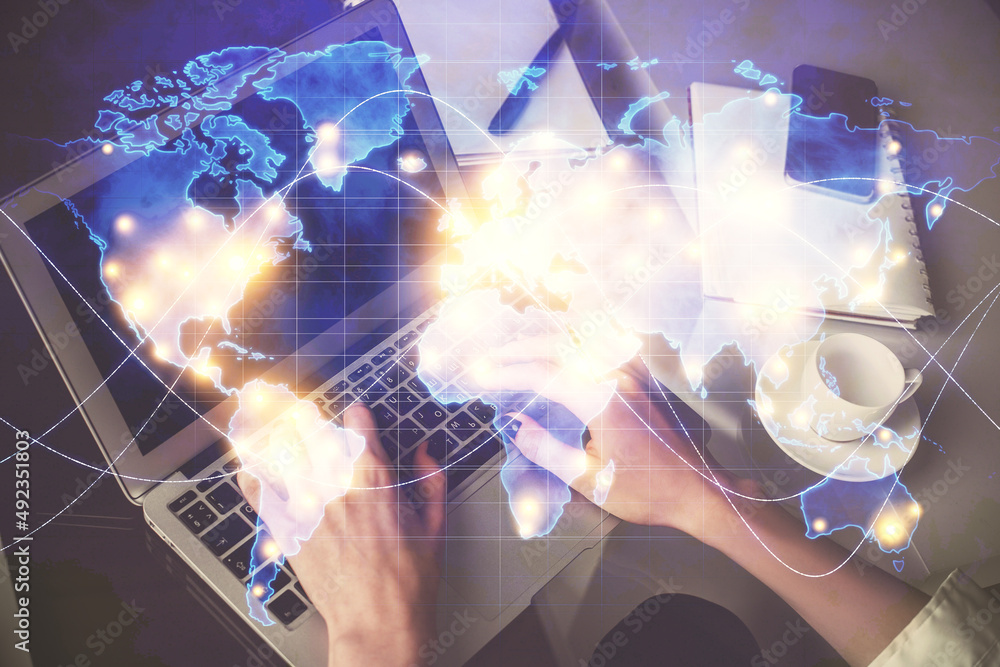 Obraz premium Double exposure of woman hands typing on computer and business theme hologram drawing. Success concept.