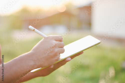 Businessman's hand using a tablet to check information