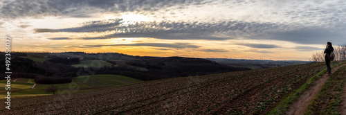 Panorama of a sunset over fields in the mountains in Eifel Germany