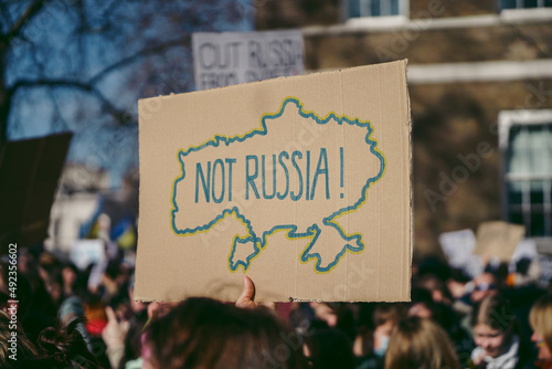 Ukrainian people protest, thousands gather to demand tougher sanctions on Russia from British Government to stop the war in Ukraine photo