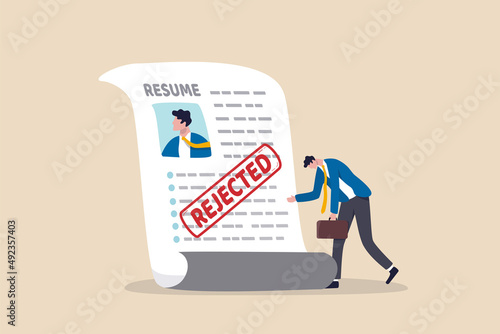 Job application rejected, disqualified or resume declined, HR human resource or hiring manager refuse, interview failure concept, sad businessman stand with his rejected resume application document.