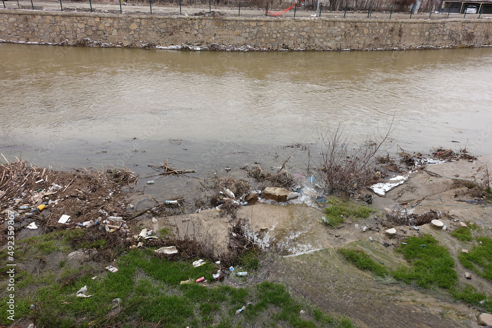 Fototapeta premium pollution of natural rivers by humans, river polluted by urban waste,