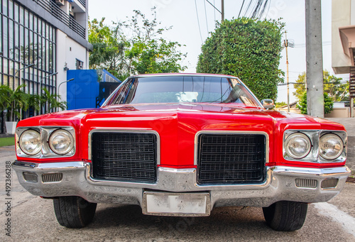 an American classic car in a parking lot in the city photo