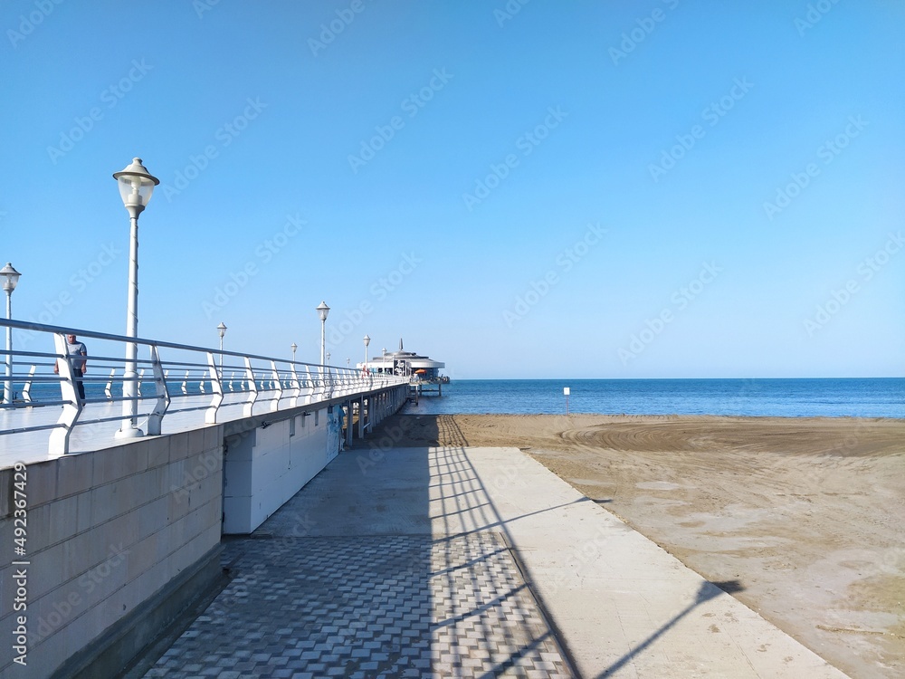 Sea view from boulevard. Caspian sea. Beautiful sea boulevard scenery with pier.