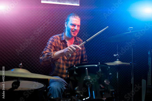 man musician playing on drums in music studio © de Art