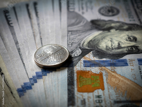 Belarus rouble coin on a hundred dollar bill. Belarus and USA money. Currency exchange. Economic crisis. War in Ukraine effect. Financial analytics. Investment and banking. Business 