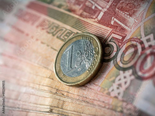Euro and rouble. Foreign currency exchange. Russia and EU. Economic crisis. Russian money. Investment, business and finance. Emerging markets. Money background. Money in cash. Euro coin on roubles
