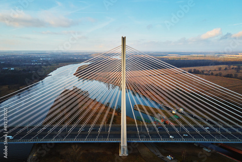 Large modern bridge over river in europe city with car traffic, aerial view. Redzinski bridge over Oder in Wroclaw, Poland © Lazy_Bear