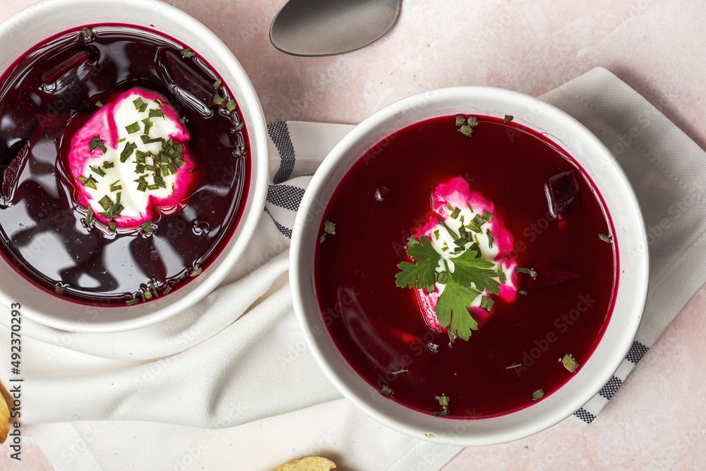Traditional Ukrainian and Russian national red borscht soup en bol with sour cream and herbs Traditional Ukrainian and Russian national red borscht soup en bol with sour cream and herbs