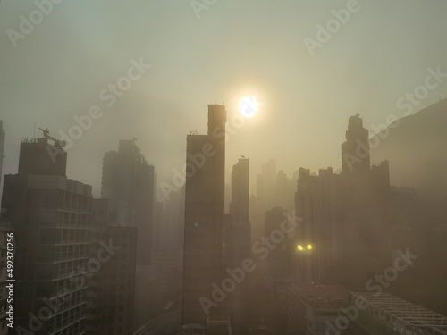 sunrise over residential buildings in Sheung wan, Hong Kong Island,. backlight