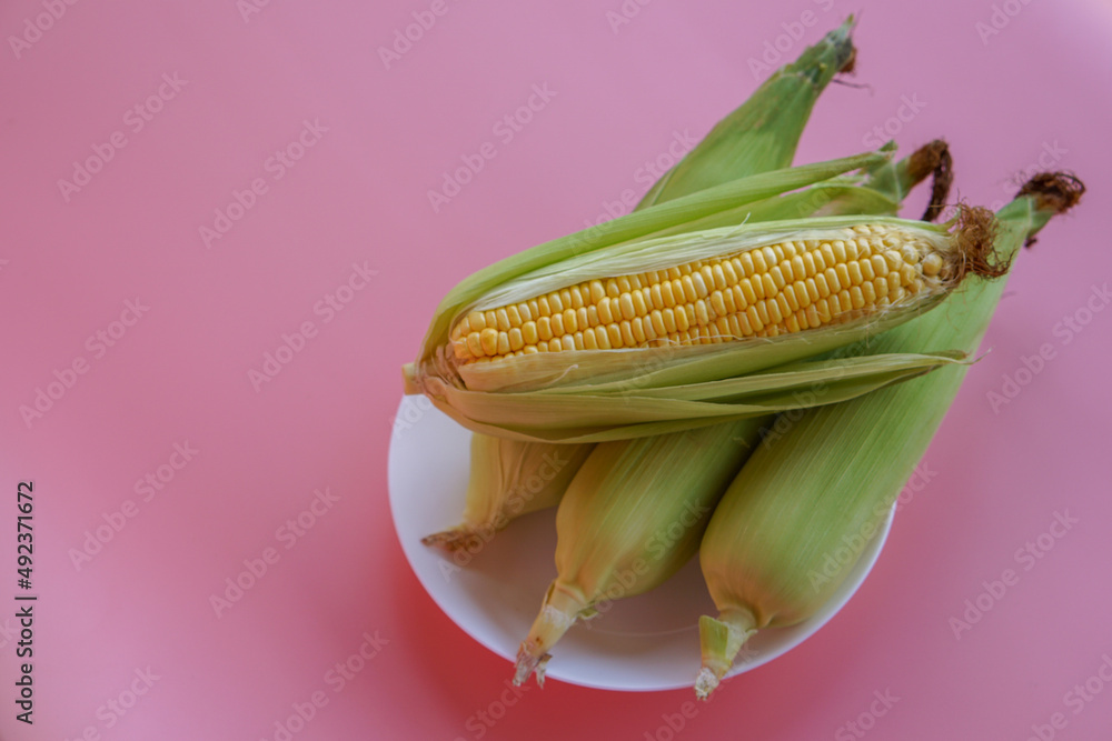 Close-up of fresh sweet corn on table Close-up of fresh sweet corn on table