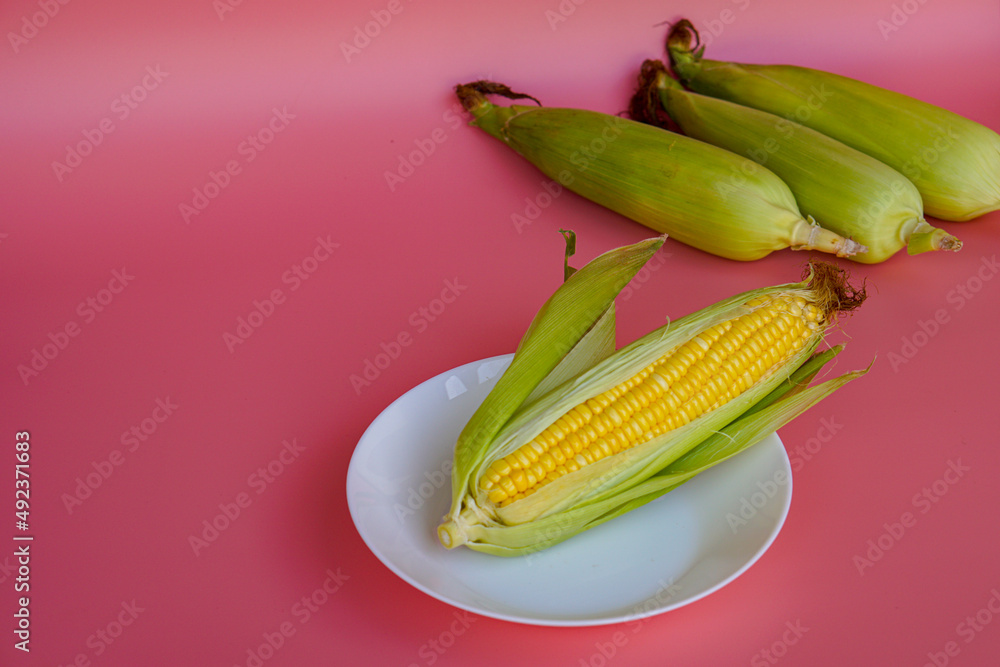 Close-up of fresh sweet corn on table Close-up of fresh sweet corn on table