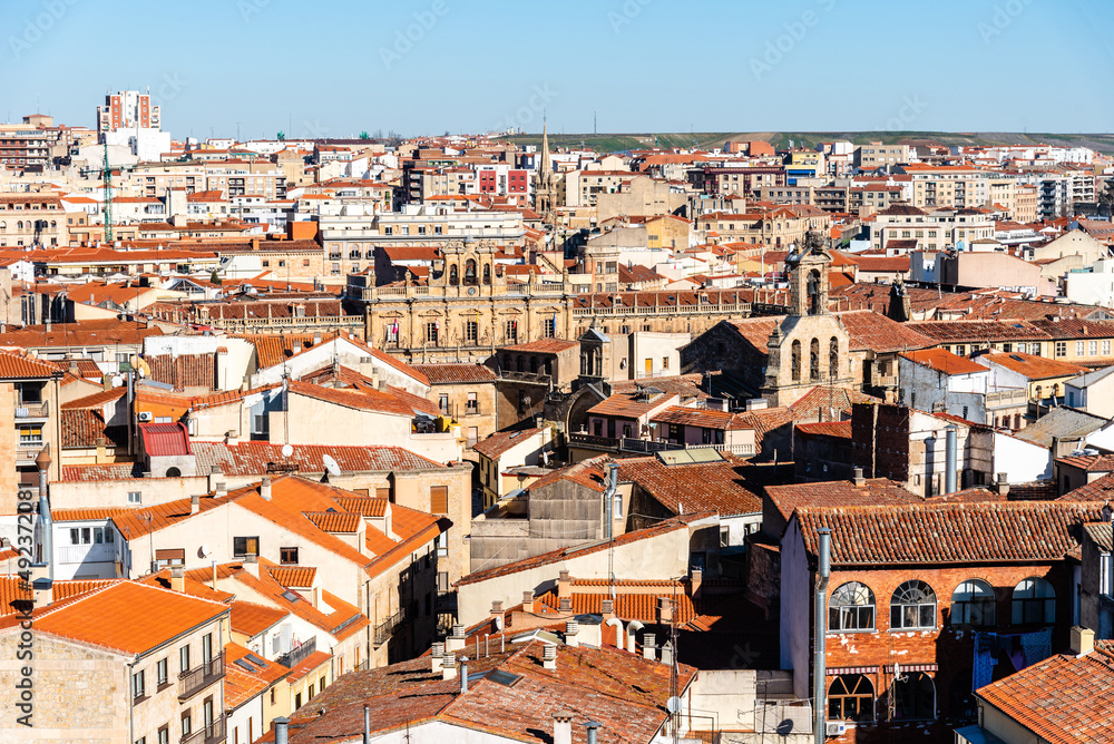 Aerial top panoramic view of historic centre of the medieval town of Salamanca with old buildings and typical terracotta tiled roofs. Castile and Leon, Spain