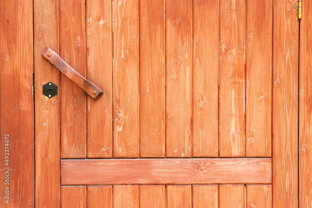 Textured wooden entrance door with oil paint Textured wooden entrance door with oil paint