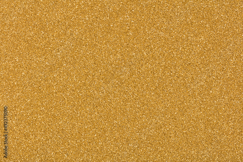 Glitter background in stylish golden tone, texture for elegant design look. High quality texture in extremely high resolution, 50 megapixels photo.