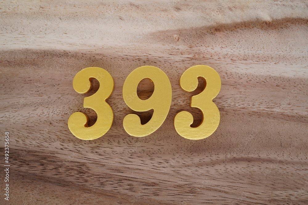 Poster Golden Arabic numerals on a real brown and white wooden floor ...