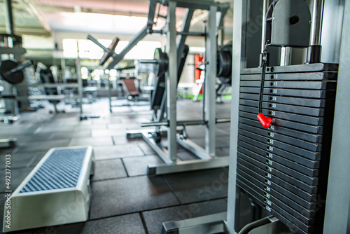  Modern lightweight gym. Sports equipment in the gym. bars of different weights on the rack.