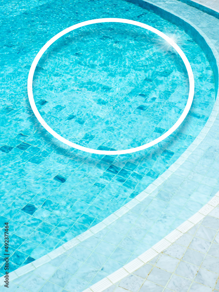 A round shape of a white line makes a decorated circle frame on the swimming pool background, vertical style. Empty blank space border frame for summer, vacation time, holiday concept.