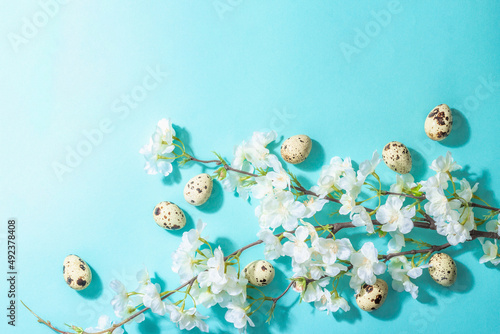 Happy Easter festive flat lay with blooming cherry and eggs  traditional symbol spring holiday