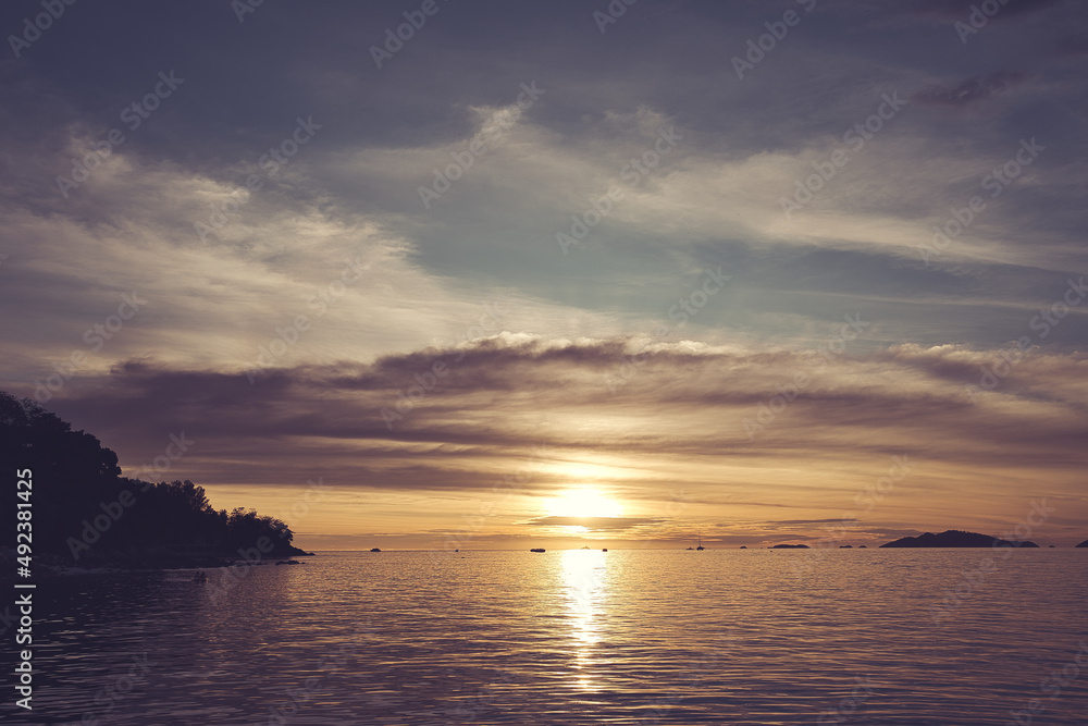 Dramatic sunset over sea with clouds in the sky - Thailand Koh Lipe Dramatic sunset over sea with clouds in the sky - Thailand Koh Lipe