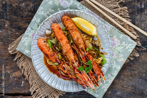 Langoustines with ginger, spring onions and crispy fried egg noodles