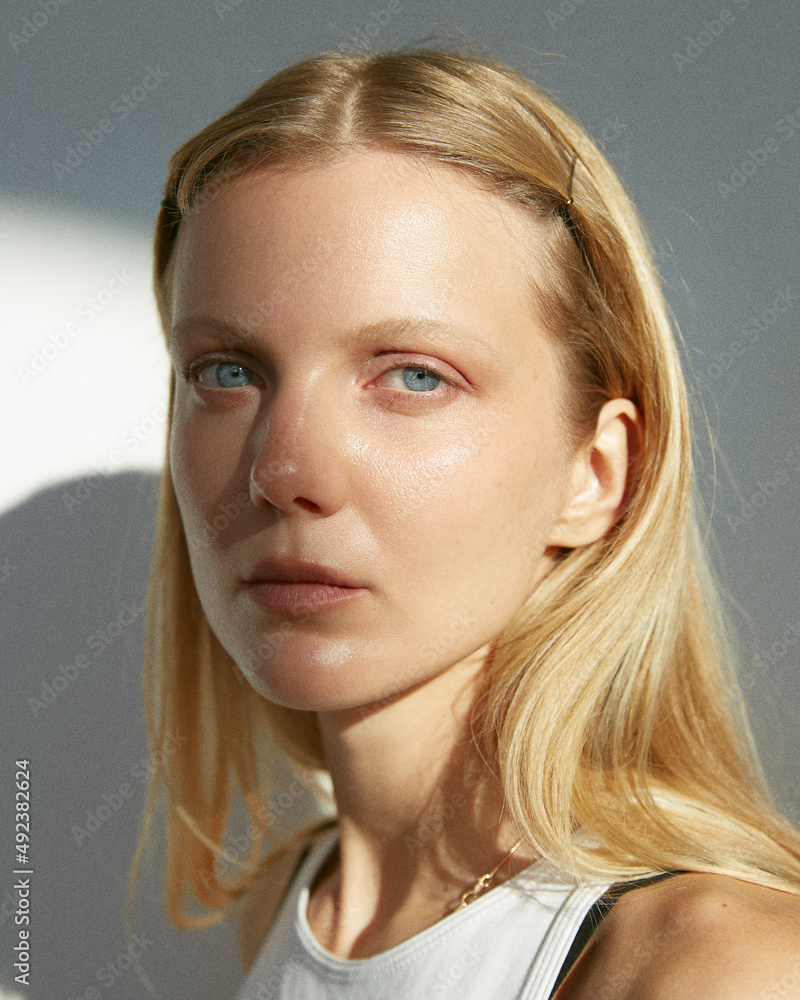 Portrait of attractive blonde woman in sunlight Portrait of attractive blonde woman in sunlight