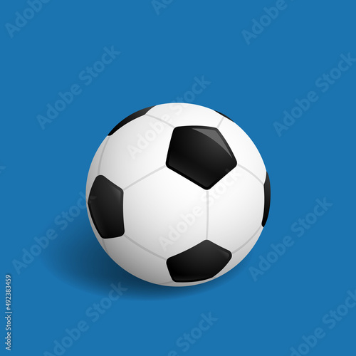 Soccer ball isolated on a blue background. Black and white soccer ball. Classical soccer ball