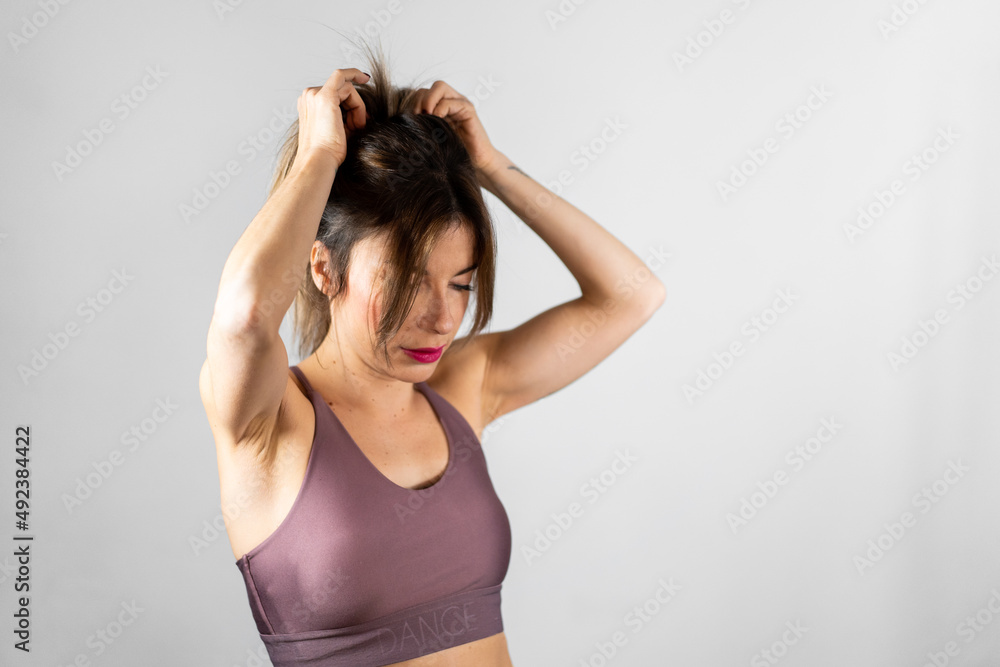 Woman dancer preparing herself before a class Woman dancer preparing herself before a class