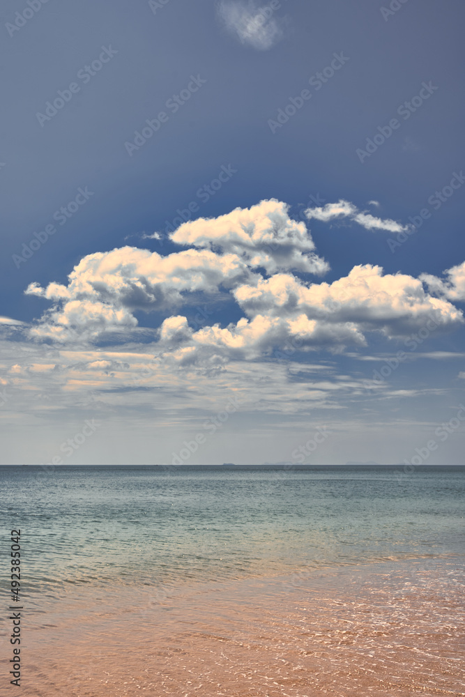 Sand beach with turquoise water and beautiful clouds in the sky - Thailand Koh Lanta