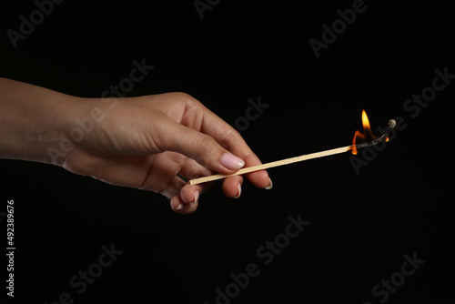 Female hand with burning fi...