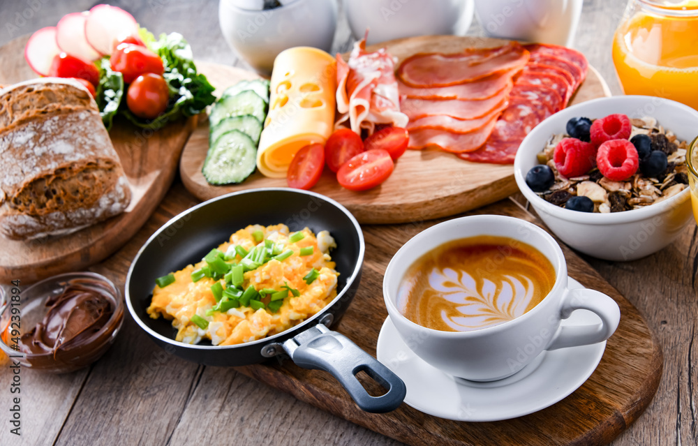 Breakfast served with coffee, scrambled eggs, cereals and ham