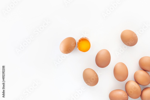 Slika na platnu Broken brown egg isolated white background.