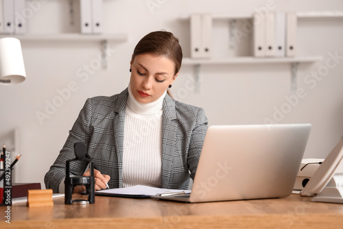 Female notary public workin...