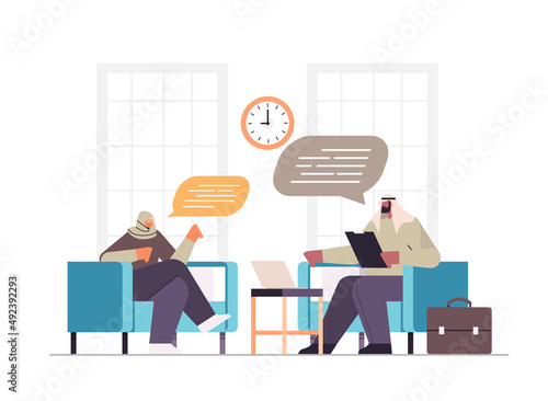 arab businesspeople couple with chat bubbles discussing during meeting business communication concept