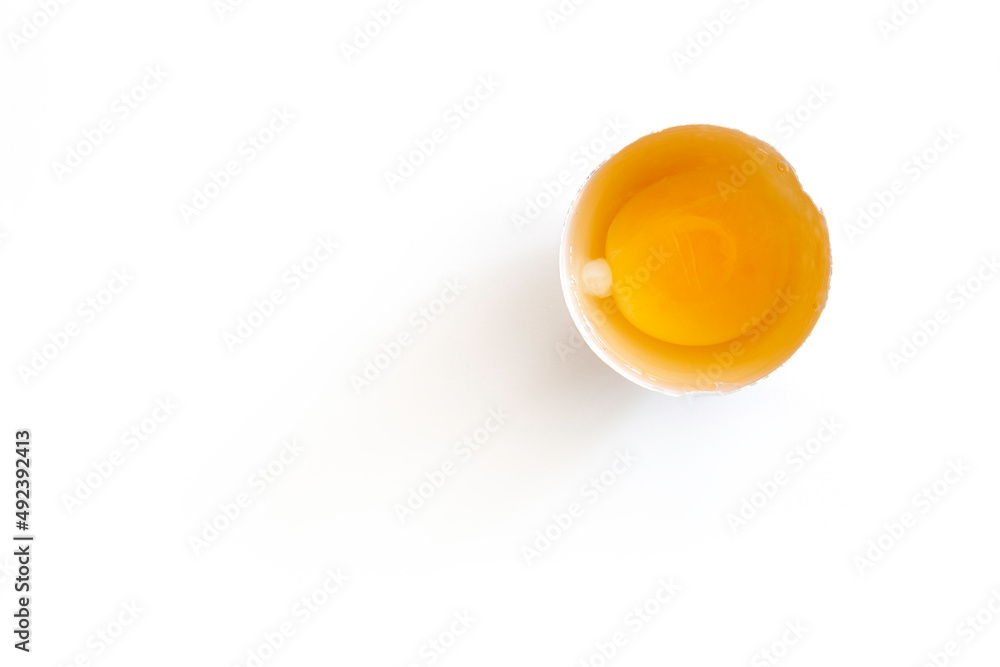 Free-range hen eggs on open egg top view.