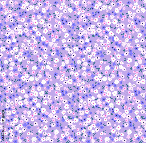 Spring flowers print. Vector seamless floral pattern. Floral design for fashion prints. Endless print made of small pastel lilac and purple flowers. Elegant template. Pink background. Stock vector.