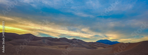 panoramic image of the great sand dunes near the San Juan Mountains of Colorado