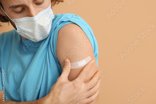 Young man in medical mask a...