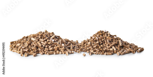 Piles of wood pellets on white background