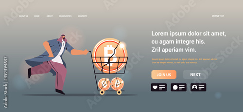 businessman pushing trolley cart with crashed bitcoins cryptocurrency crash price collapse crypto loss investment risk crisis