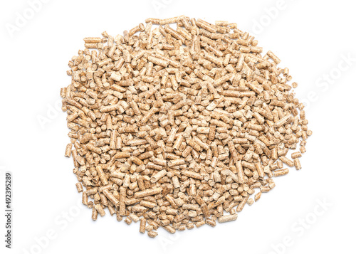 Pile of wood pellets on whi...