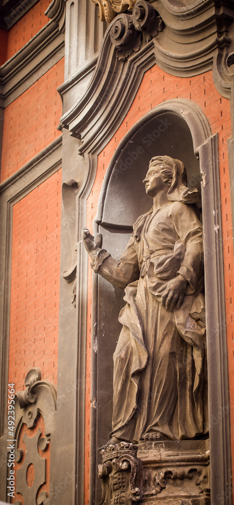 religious statue on a Church wall in Naples Italy 
