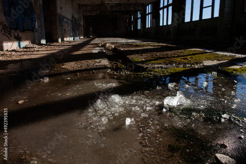 ice lies on the floor of an abandoned workshop