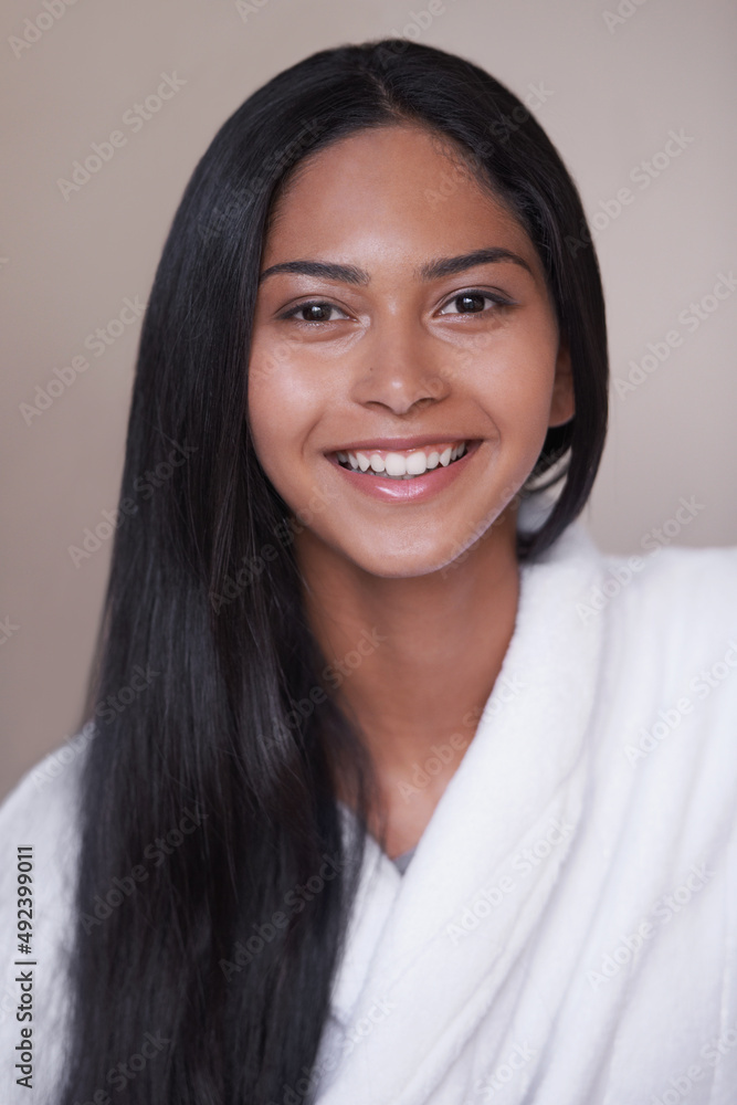 Shes excited for her day of pampering. Studio shot of a beautiful young woman in a bathroom. Shes excited for her day of pampering. Studio shot of a beautiful young woman in a bathroom.