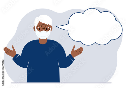 Grandfather with medical mask and blank thoughts, speech bubble. Hands are spread apart. Place for your text.