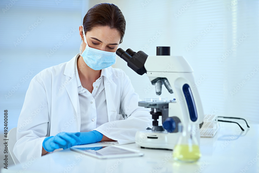Observe carefully to help maintain accuracy. Shot of a female scientist working alone in the lab. Observe carefully to help maintain accuracy. Shot of a female scientist working alone in the lab.