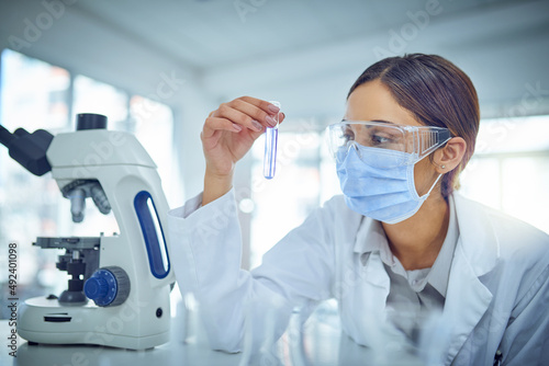 Discovering solutions through science. Shot of a young scientist working in a lab.